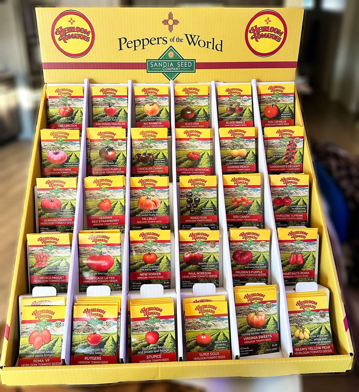 Tomato Seed Assortment - Wholesale 30 Varieties - 360 Packets in a retail display box featuring heirloom tomato seed packets for home gardening.