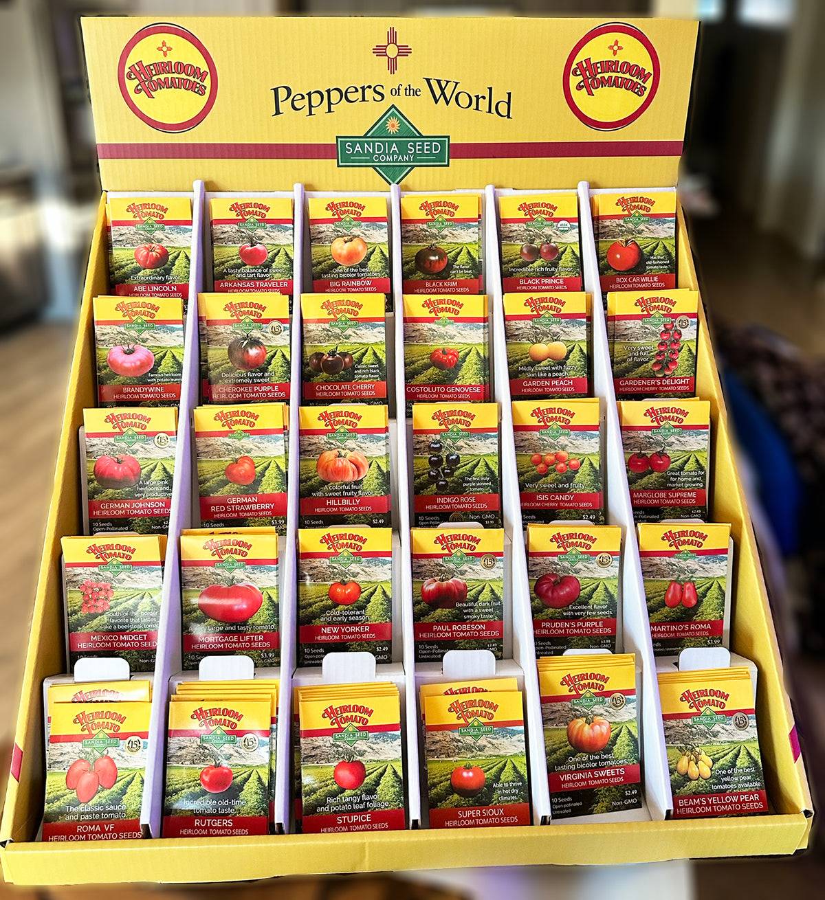 Tomato Seed Assortment - 30 Varieties Wholesale - 360 Seed Packs in countertop display for retail. Includes heirloom tomato seed packets in vibrant packaging.
