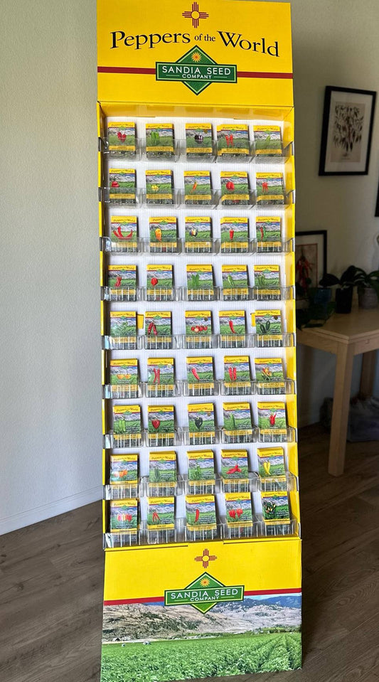 Popular Pepper Assortment - 45 Varieties - Wholesale 540 Packets in a tall yellow floor display rack featuring Sandia Seed branding for retail.