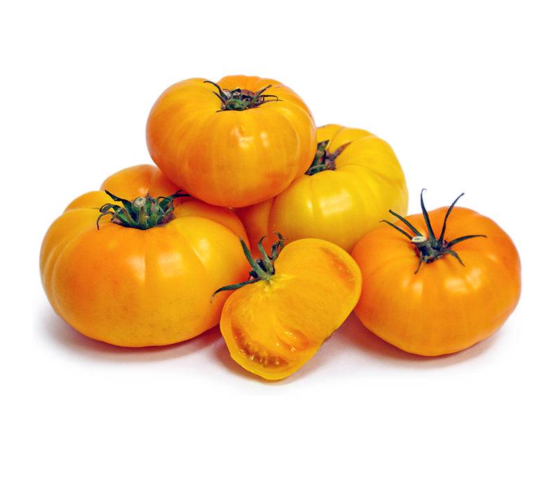 Cluster of ripe Yellow Brandywine tomatoes with one sliced open, highlighting juicy texture and sweet, tangy heirloom flavor.