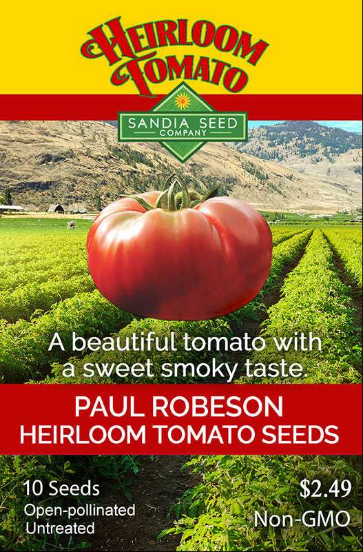 Heirloom Paul Robeson tomato seeds package featuring a large ripe tomato, green fields, and mountain landscape, with red and yellow design elements.