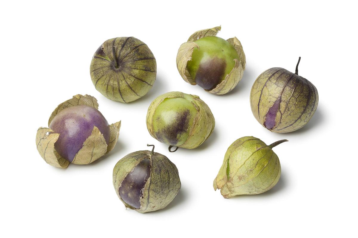 Group of purple tomatillos on a white background