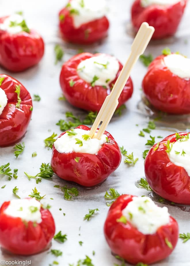 Stuffed Hot Red Cherry Peppers filled with creamy cheese and garnished with herbs, showcasing a delicious way to use these medium-heat peppers.