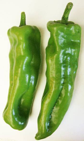 Marconi Giant F1 Pepper Seeds - Smoky-Sweet Flavor - High Yield; two large green sweet peppers with smooth, shiny skin, perfect for home gardens.