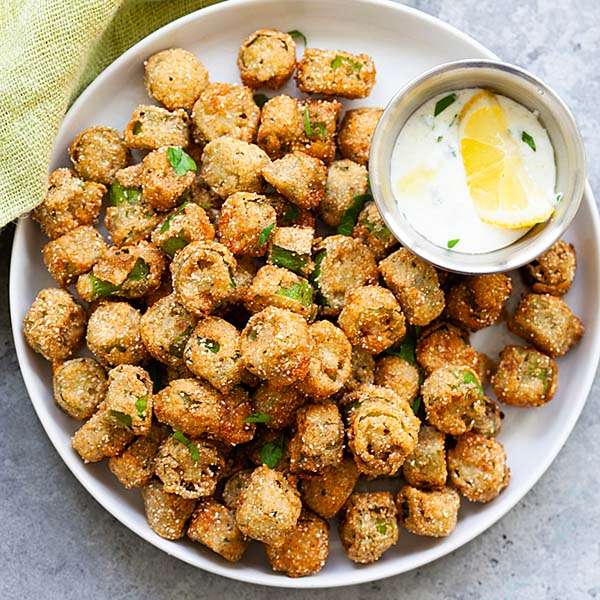 Crispy fried Clemson Spineless okra served with dipping sauce. A delicious way to enjoy homegrown okra harvested from your garden.