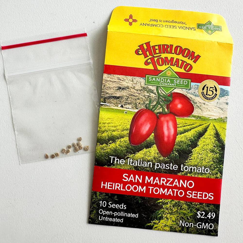 Open San Marzano Roma Tomato Seeds packet with visible seeds, labeled heirloom, non-GMO, ideal for home gardening and flavorful red plum tomatoes.