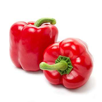 Two fresh, glossy red Yolo Wonder bell peppers with green stems. Perfect example of sweet, easy-to-grow peppers from Yolo Wonder Pepper Seeds.