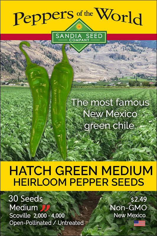 Seed packet featuring two green Hatch Green Medium chili peppers, colorful label with field and mountain scenery, and product details.