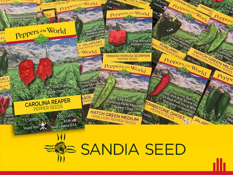 Close-up of assorted pepper seed packets including Carolina Reaper from the 45 Pepper Varieties Wholesale Assortment by Sandia Seed.
