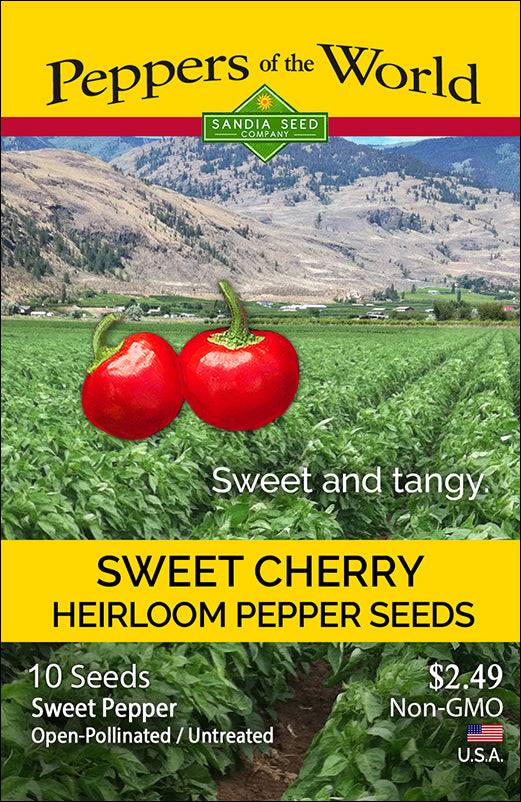 Sweet Cherry Heirloom Pepper Seeds packet showing red peppers over a lush green field, labeled GMO-free and open-pollinated.