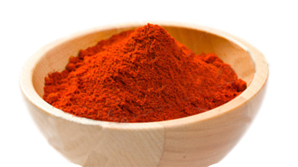 Bowl of vibrant red chile powder made from Hatch Red Hot Sandia Hot chiles. Thin-walled, flavorful, and perfect for seasoning dishes.