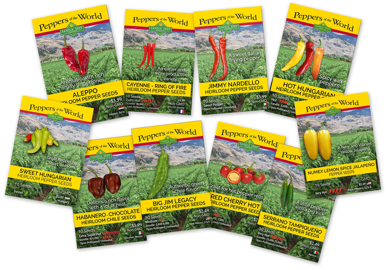 A collection of seed packets for various heirloom and spicy pepper varieties, including jalapeño, cayenne, and Hungarian peppers, from Peppers of the World by Sandia Seed Company.