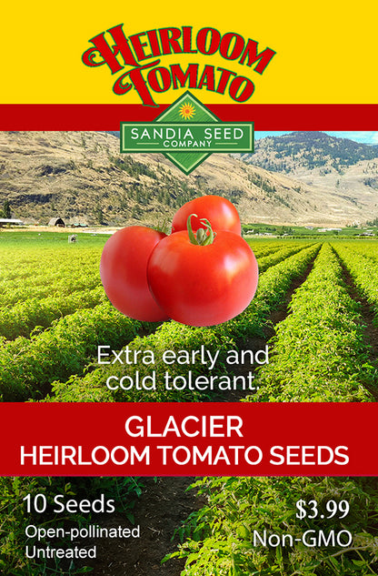 Glacier Heirloom Tomato Seeds packet with tomatoes and a field in the background.