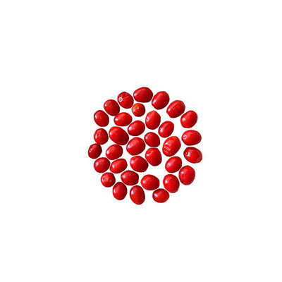 Chiltepin Chile Seeds - Buy Super Hot Pepper GMO-Free; close-up of ripe red Tepin peppers arranged in a circular pattern for seed packaging.