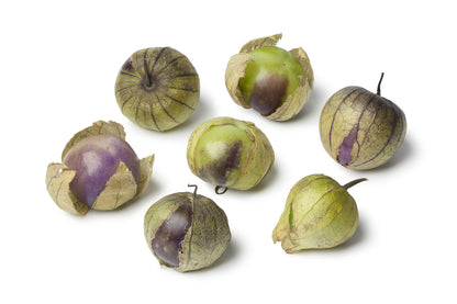 Group of purple tomatillos on a white background
